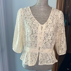 Kylee Eyelet Lace Peplum Top Size XL Condition is NWOT.  Cream lace 3/4 sleeve